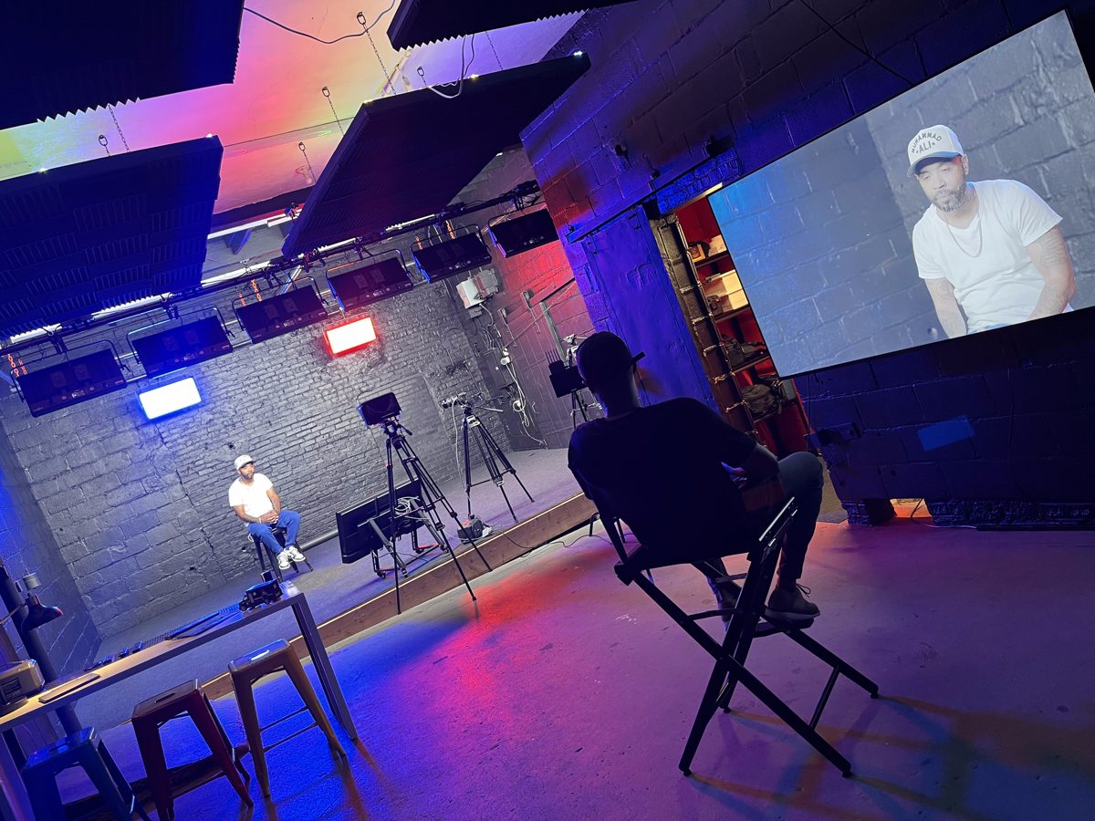 SIC+ media room with studio lighting, cameras and a large screen